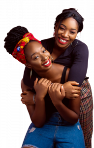 two black girls hugging and smiling