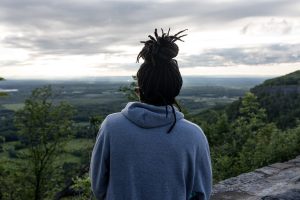 black woman looking at mountains