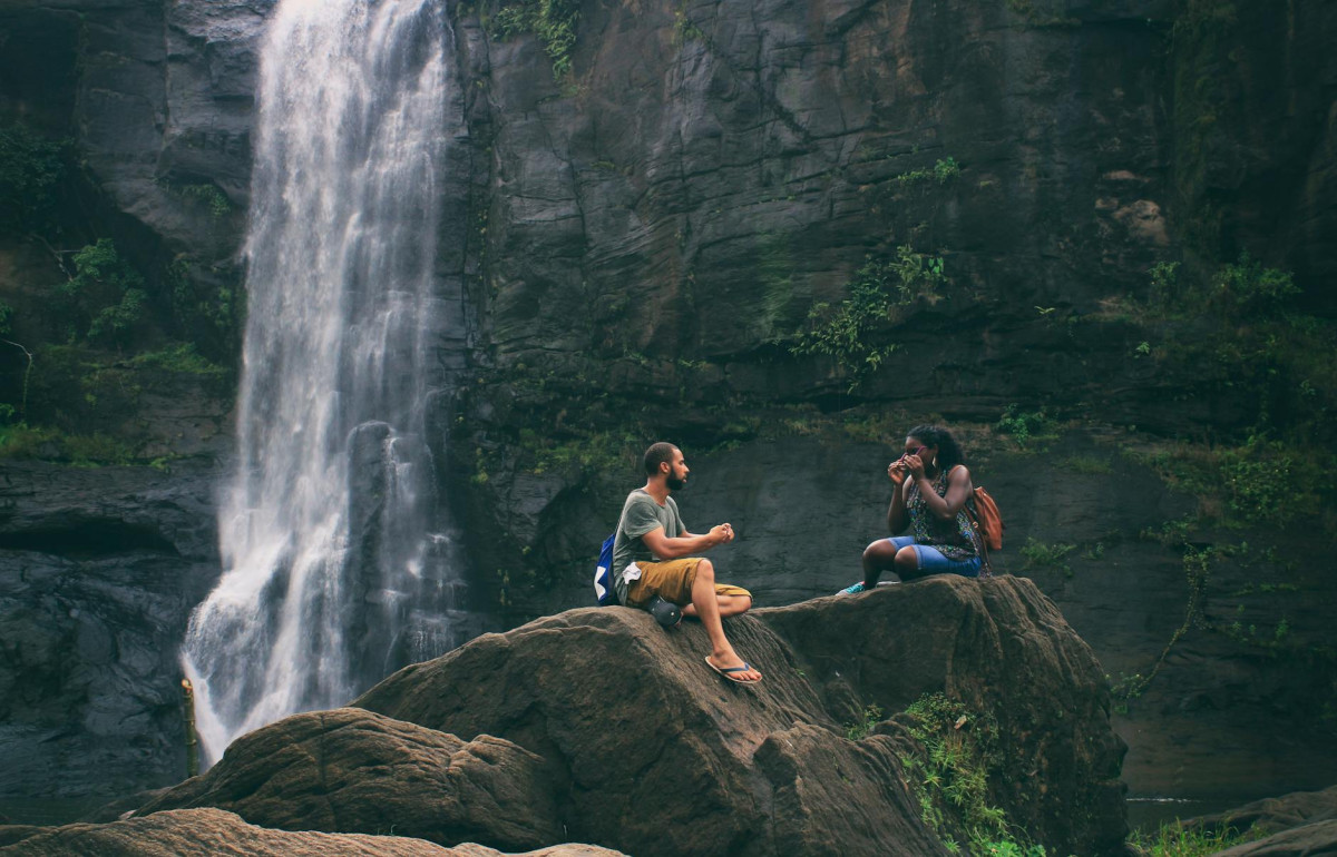 man and woman near waterfall relationship goals