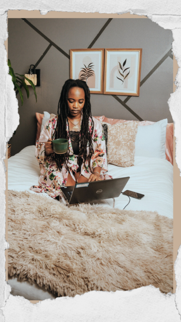 black girl sitting on bed with laptop showing women how to be that girl